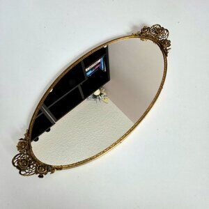 Vintage vanity oval mirror tray with brass floral roses design.
